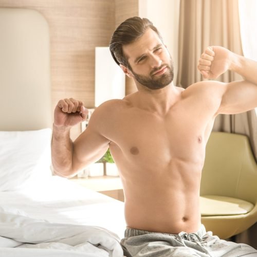 Young male traveler tourist hotel accomodation waking