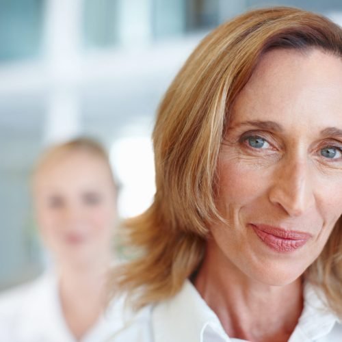 Mature female executive with business woman.