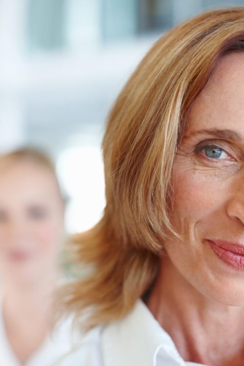 Mature female executive with business woman.