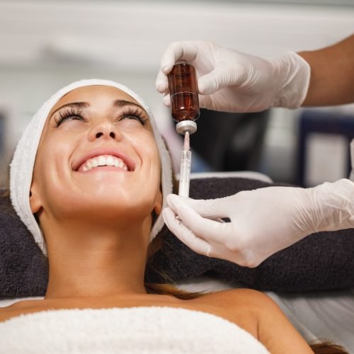 Shot of a beautiful young woman on a facial micro-needling treatment at the beauty salon.